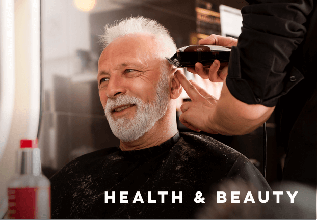 a man receiving a haircut, with text reading Health and Beauty