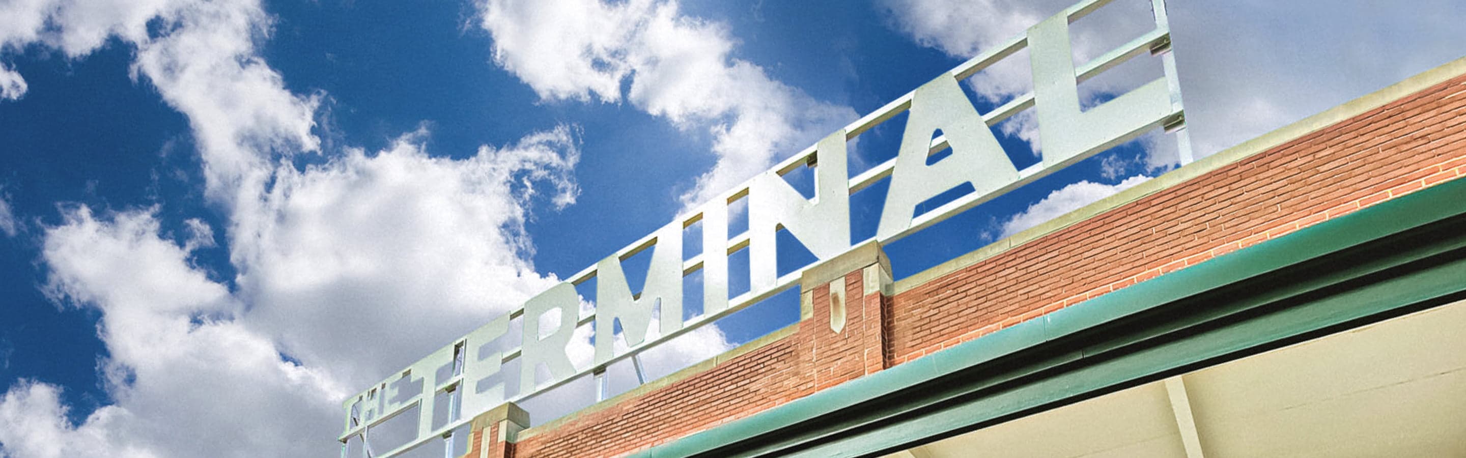 The Terminal logo in metal on top of the Terminal building